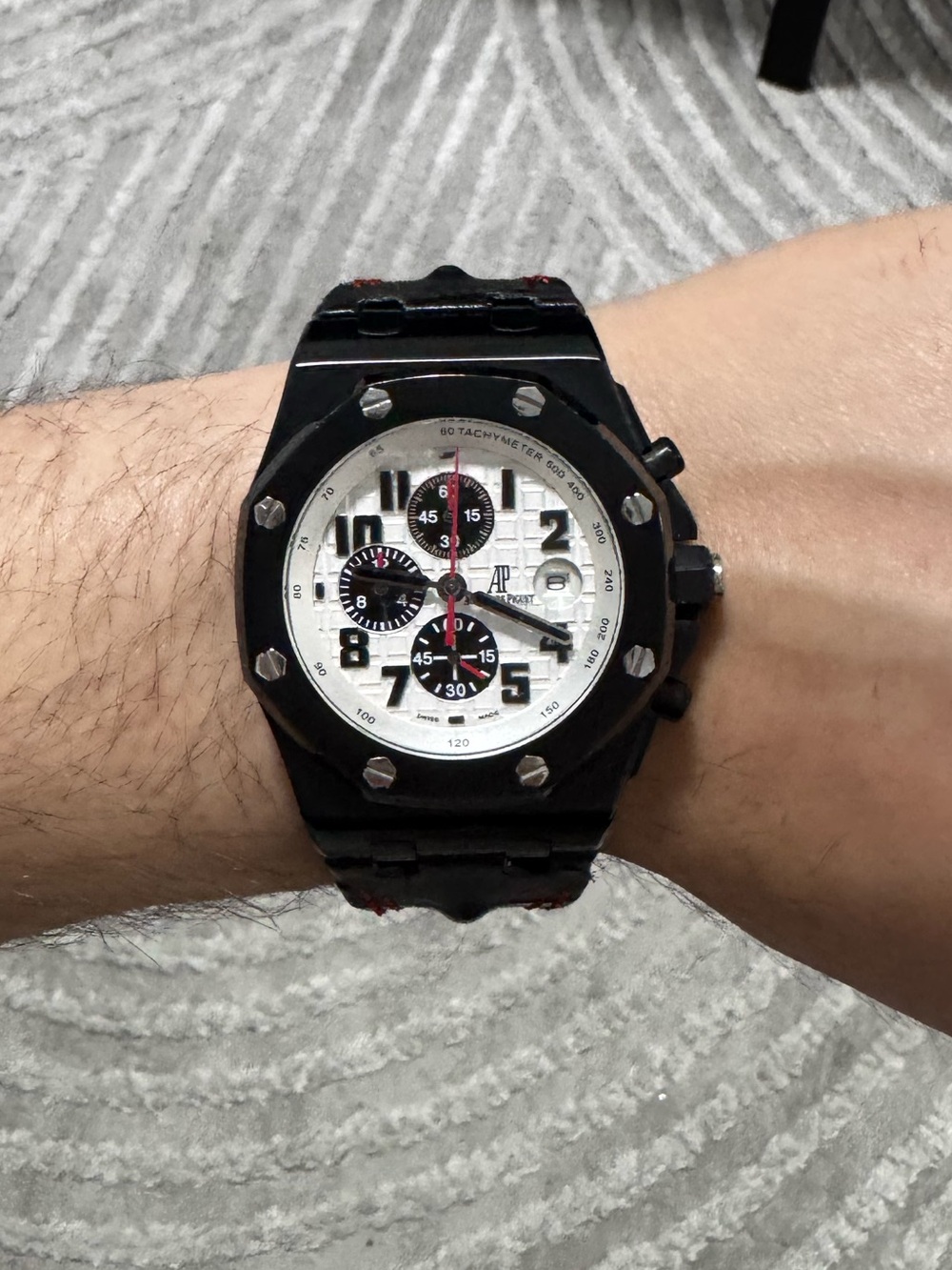 Audemars Piguet Black Case Watch with White Dial and Red Accents
